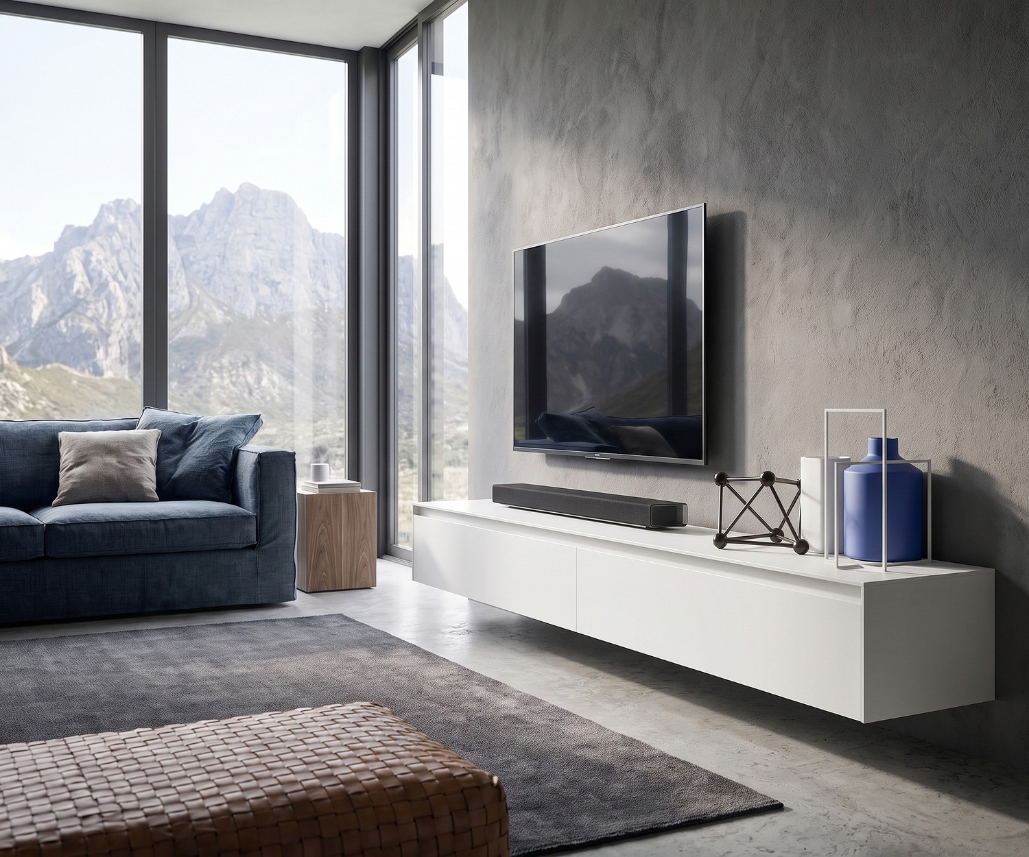 Mobile porta TV sospeso Reverse di Novamobili in un soggiorno moderno con parete in cemento