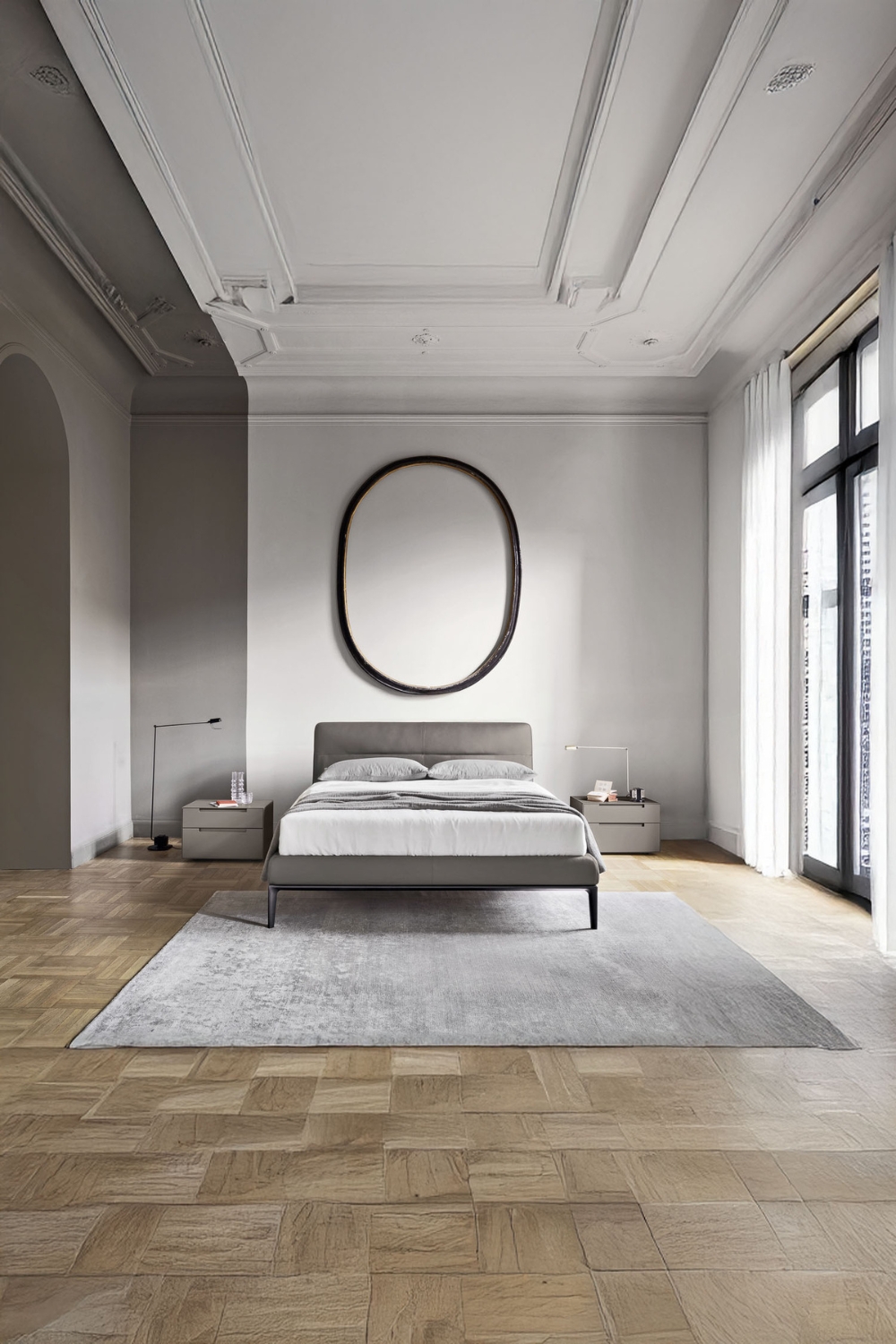 mobili moderni grigi per la camera da letto in un edificio d'epoca con soffitto decorato a stucco