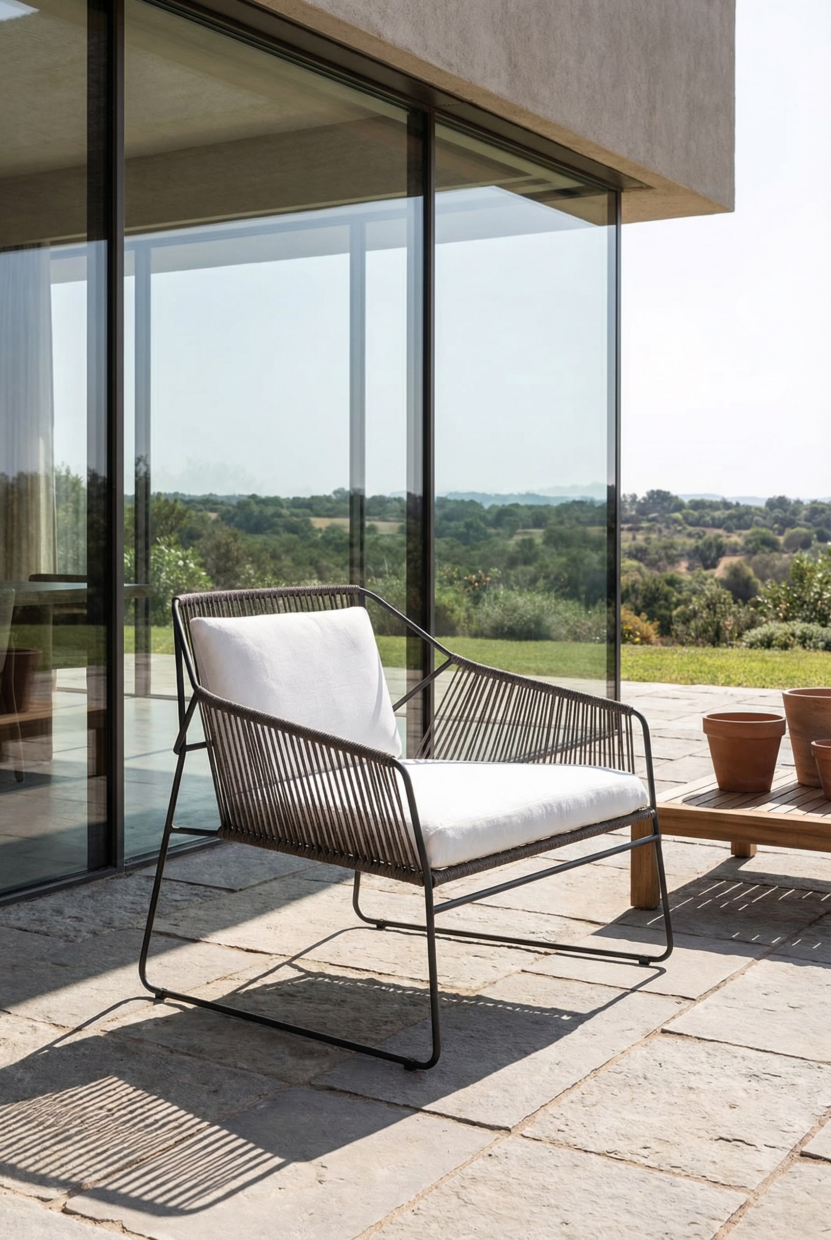 Poltrona da esterno trasparente con rivestimento in corda