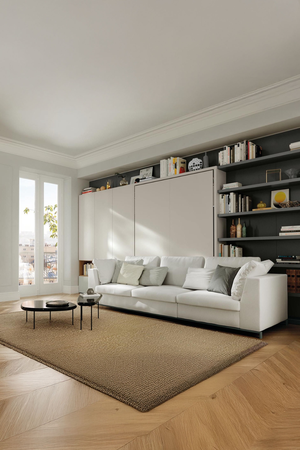letto-a-scomparsa-bianco-purista-con-grande-divano-e-due-tavoli-scuri