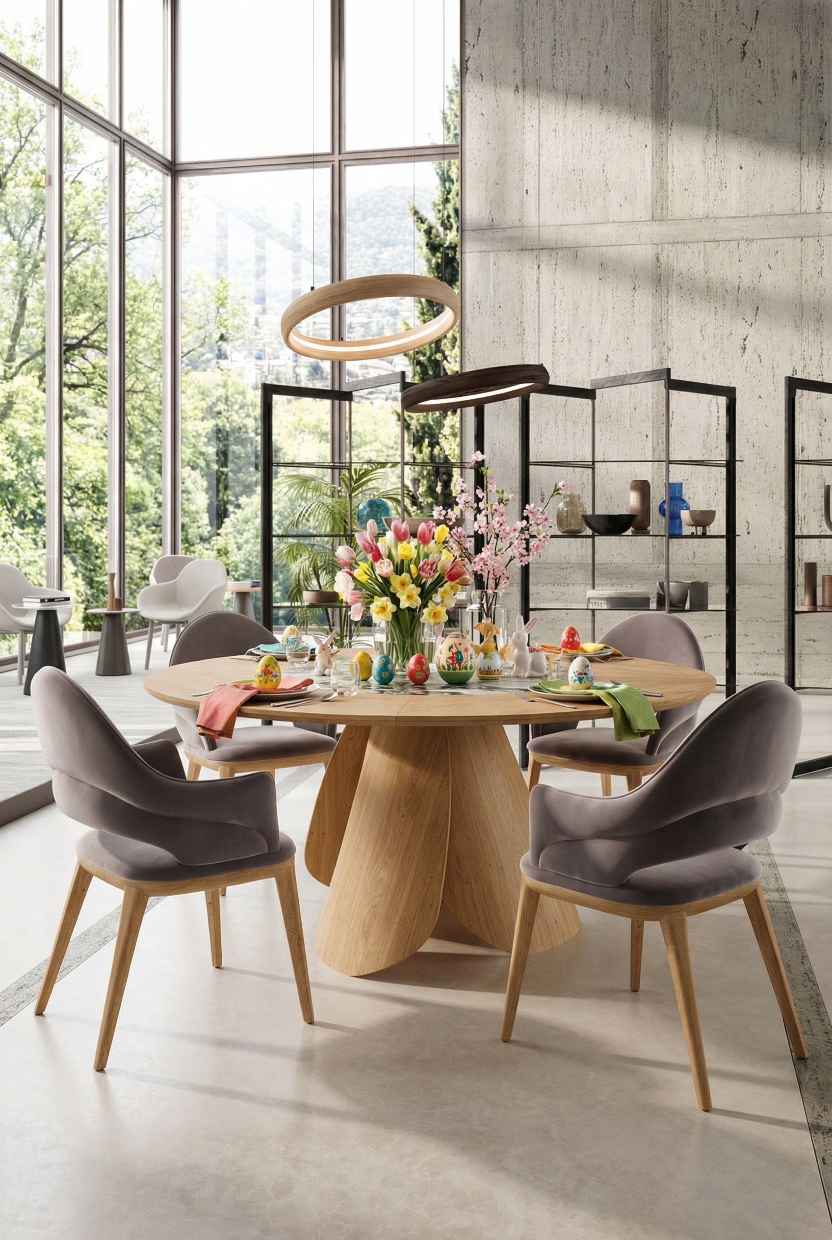 Tavolo da pranzo rotondo Ozzio Veliero in legno chiaro in una sala da pranzo d'architetto inondata di luce