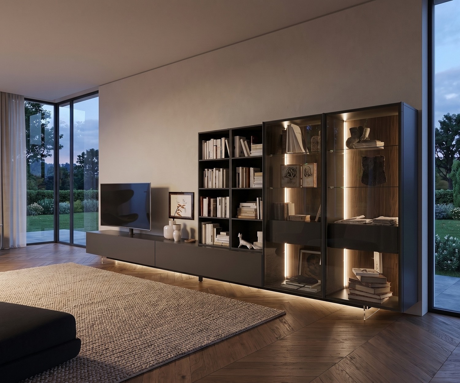 Zoccolo TV trasparente Livitalia sotto mobile basso scuro in soggiorno moderno per un effetto sospeso illuminato.
