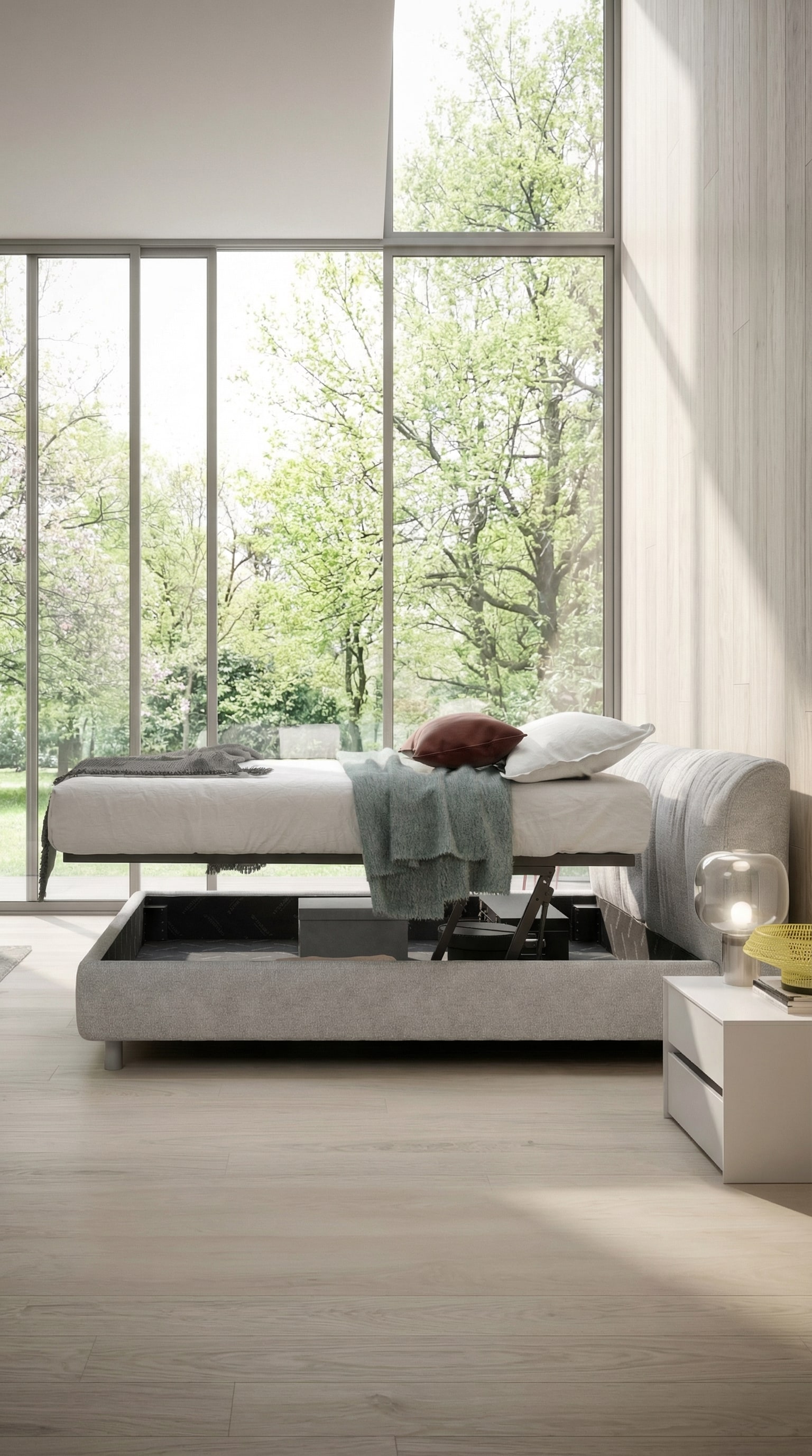 Letto imbottito Novamobili Belleville con contenitore in una camera da letto luminosa e primaverile